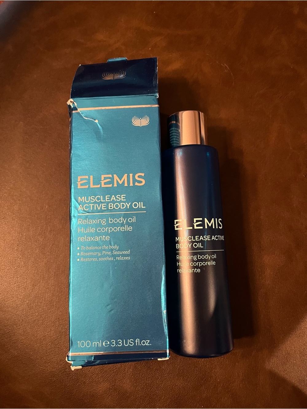 ELEMIS Musclease Active Body Oil in Deep Blue Bottle and Teal Box